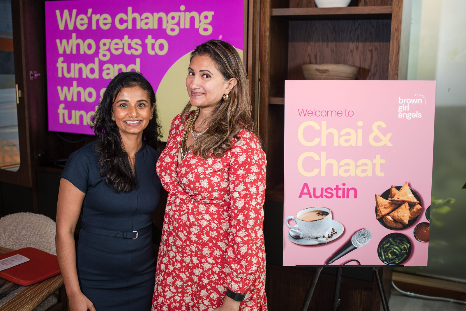 Bhargavi Varma with a Chai & Chaat Austin guest in front of the ‘changing who gets to fund’ screen